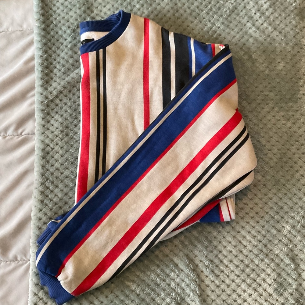 Grey, black, red and blue vertically stripped sweater